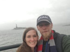 Russell & his wife Elasa by the Statue of Liberty in NYC